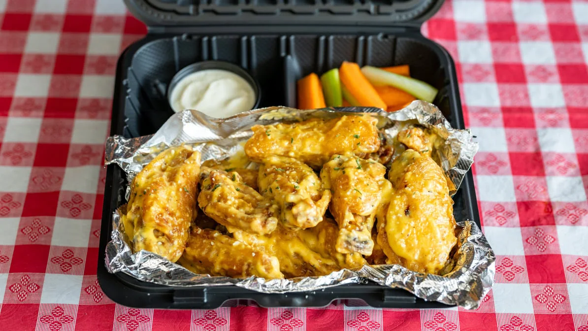 Garlic parmesan wings with dip, carrots and celery