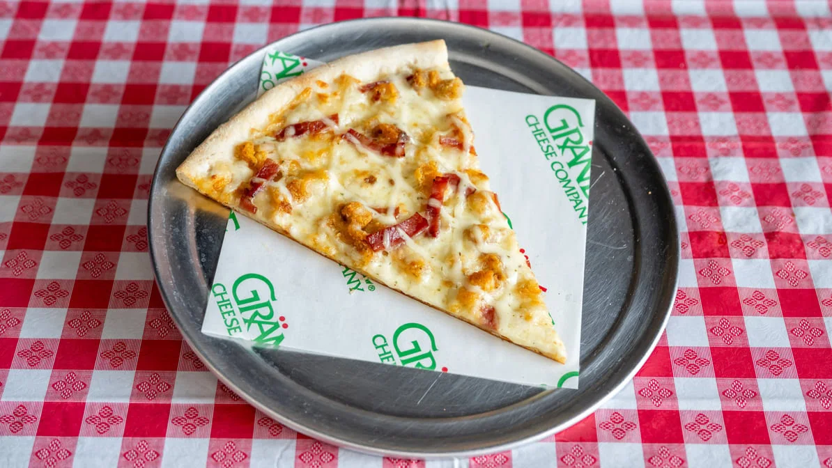 Chicken bacon ranch white pizza slice