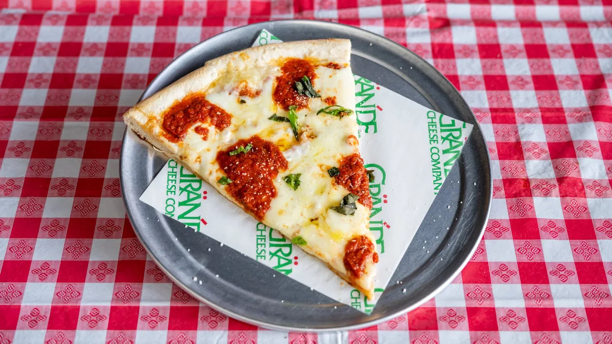 Cheese pizza slice fresh from the oven at Quick Slice Pizza