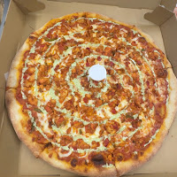 Whole pizza in a box from Quick Slice Pizza