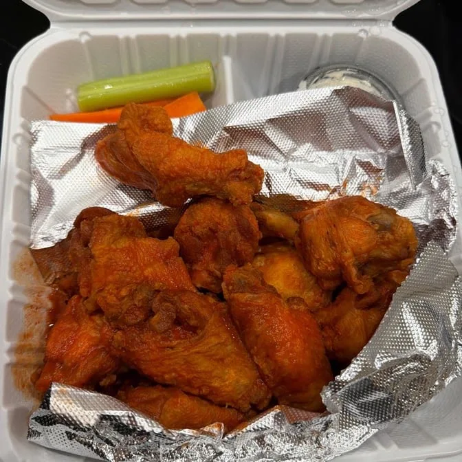 Buffalo wings with celery, carrots and dip from Quick Slice Pizza
